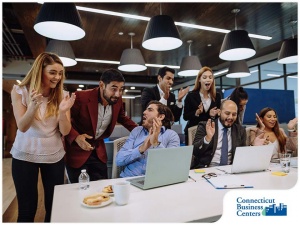 180-1616684010-happy-employees-interacting-with-each-other-in-the-office-space.jpg