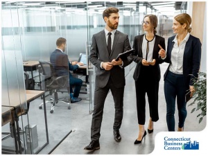 180-1629352398-A-team-of-managers-walking-through-an-office-space-in-connecticut.jpg